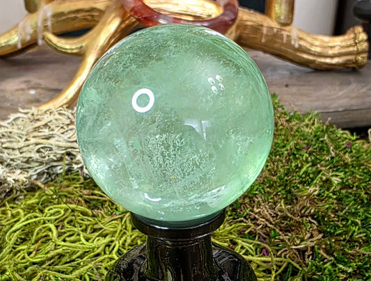 Green Fluorite Sphere on a Black Vase B