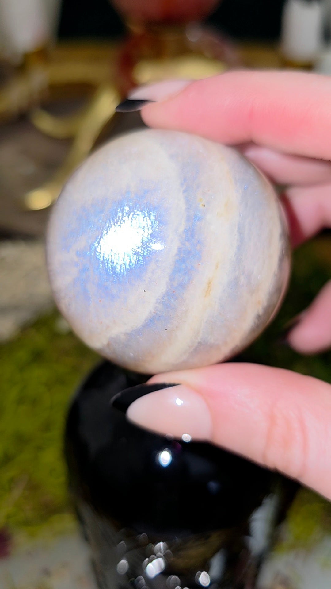 Moonstone Sphere on a Black Vase A