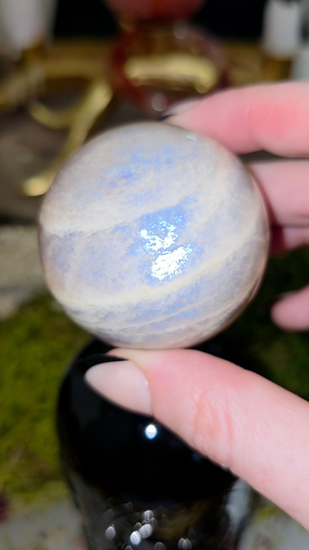 Moonstone Sphere on a Black Vase A
