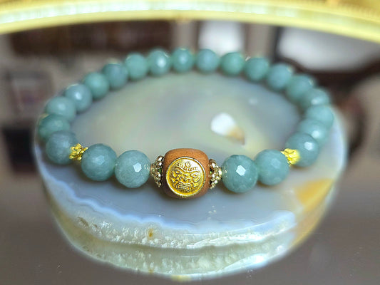 Jadeite and Wood Stretch Taotie Mask Bracelet